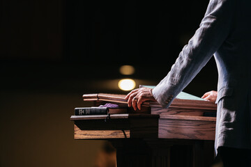 Pastor with hands on pulpit, Preacher Preaching