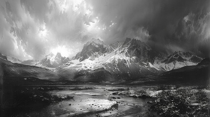 Fototapeta na wymiar An image of snow capped mountains in black and white style. Monochrome image. 