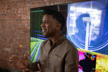 African American businessman giving a presentation on green business