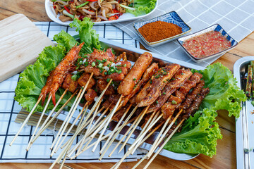 Stick BBQ involves grilling a variety of meats and vegetables on long, thin bamboo. Chinese stick BBQ. mala grills