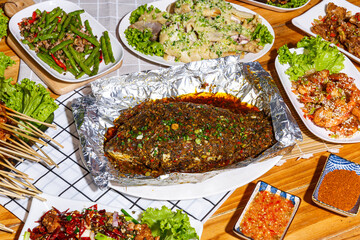 Mala restaurant food. grill fish with herbs, Spicy Century Egg Salad, Grilled Chives, choy soup, Spicy Braised Chicken Feet, mala style. China popular dish