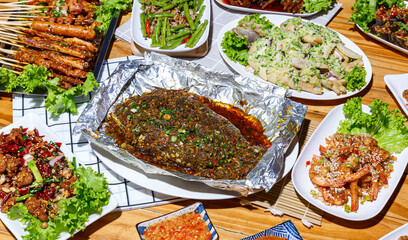 Mala restaurant food. grill fish with herbs, Spicy Century Egg Salad, Grilled Chives, choy soup, Spicy Braised Chicken Feet, mala style. China popular dish
