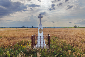 Wayside shrine on a field in Wegrow County, rural area of Mazowsze region in Poland