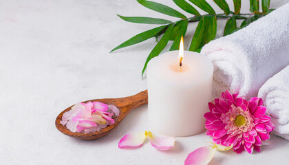 Beauty spa treatment with candles towels