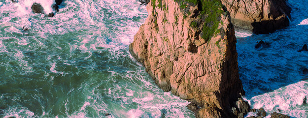 Rocky seascape on a sunny day. View of the sunny bay in Setubal, Portugal. Horizontal banner - 757338207