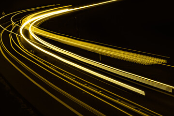 yellow car lights at night. long exposure