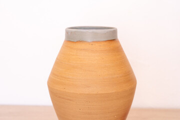 Handmade ceramic vase, white background, red. High quality photo