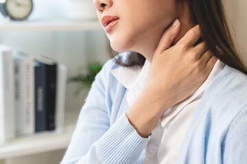 Office workers have neck pain from bad posture during sitting and work.