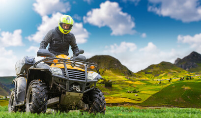 Adventurous ATV Rider Exploring Vibrant Green Hills Under a Blue Sky