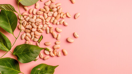 Pile of beans and leaves on pink background