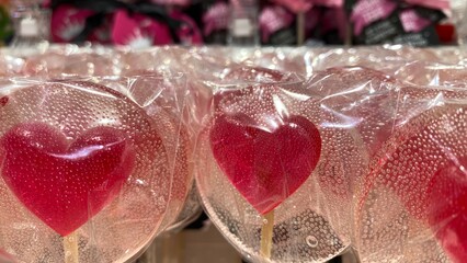 lollipop on a stick. heart-shaped lollipop. candy in transparent packaging