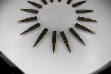 Circle Of Live Ammunition Laid Out In White Surface With Backlight 
