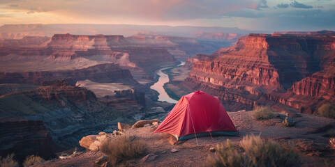 Red Tent Perched Overlooking Sunlit Grand Canyon and River Below at Sunset, banner with copy space