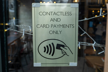 LONDON- Sign in central London retail shop stating that only contactless and card payments allowed. No Cash.