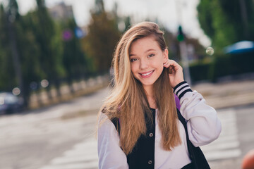 Photo portrait of charming teenager woman schoolgirl tuck hair behind hair wear trendy uniform...