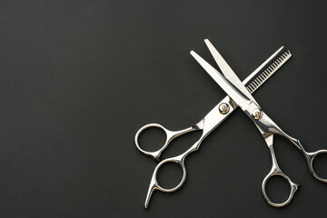 Hairdressing scissors on black background studio shot