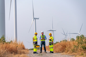 Engineer surveyor and manager wearing uniform walking holding box inspection and tablet work in...