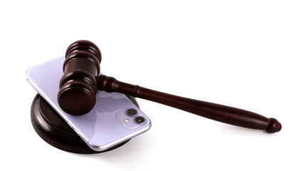 Modern smartphone and judge's gavel on a white background