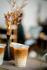 Glass of iced coffee in coffee shop, copy space and isolate concept.