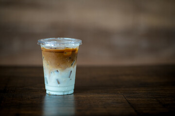 Glass of iced coffee in coffee shop, copy space and isolate concept.
