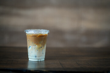 Glass of iced coffee in coffee shop, copy space and isolate concept.
