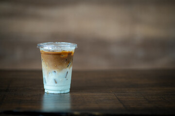 Glass of iced coffee in coffee shop, copy space and isolate concept.