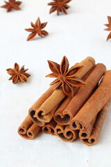 Cinnamon and star anise on a light background. Fragrant spices for baking and preparing food and drinks.