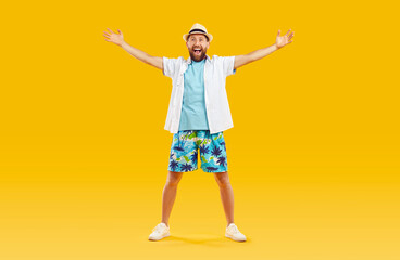 Cheerful funny man in beach clothes with outstretched arms is glad to see you at summer resort....