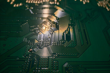 Circuit board. Technological electronic plate with roads and other components, selective focus. Technology background, electronics texture.