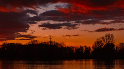 Summer sunset with reflections near Plattling, Isar, Bavaria, Germany