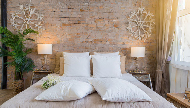 pillows on the bed in loft style bedroom