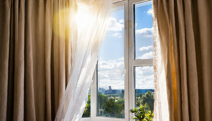 Sun shines in open window, blowing wind moves curtain.