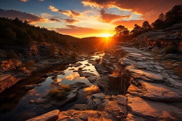 Sunset over river in mountain valley, with sky reflecting on water - obrazy, fototapety, plakaty