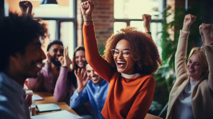 Fototapeta premium Group of professionals in an office setting, celebrating a success with raised arms and joyful expressions, indicating a sense of teamwork and achievement.