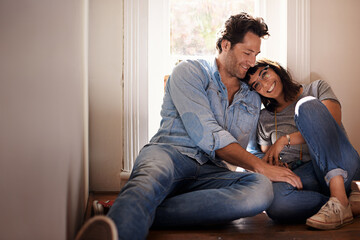 Floor, relax or happy couple laughing in home living room in conversation and speaking together. Man, funny woman or romantic people in apartment or house talking with love, support or joke humor