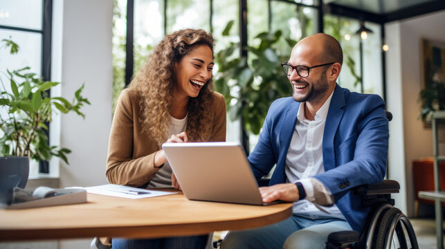 Person i wheelchair having a pleasant conversation, with another coworker in the office.