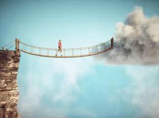Man walking on a rope suspension bridge. Travel concept. - 757397004