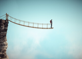 Surreal scene with a rope bridge cut in half suggesting the concept of dead end or impossible situation. - 757397022