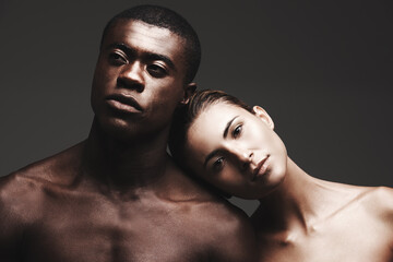 Portrait, balck man or woman in skincare, dermatology or beauty as health, wellness or love. Interracial couple, glow or face as healthy, aesthetic or diversity in bonding together on grey background