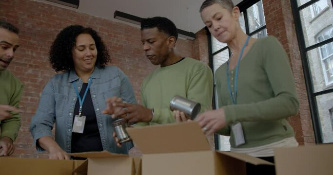 Volunteers doing Charity Work, Making Donation Boxes