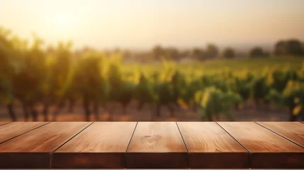 Foto op Plexiglas a wooden table with a blurred vineyard in the background © VEROPRO