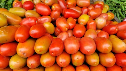Bunch red and yellow tomatoes in vegetable market