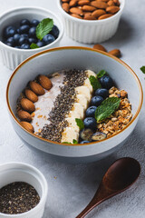 Smoothie bowl with granola, banana and berries