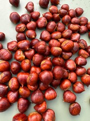 A stack of chestnuts, a natural food ingredient, on a table