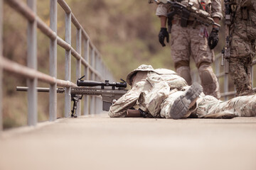 Soldiers in camouflage military uniforms carrying weapons, Reconnaissance missions in the tropical...