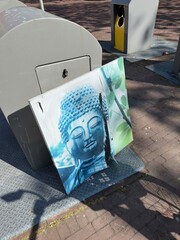 buddha image at trash, the end of spirituality