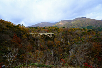Bridge passing through Naruko Gorge in autumn season.