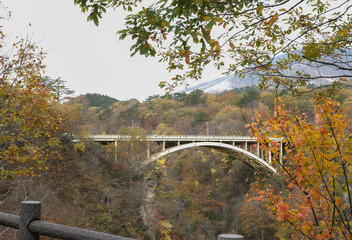 Bridge passing through Naruko Gorge in autumn season.