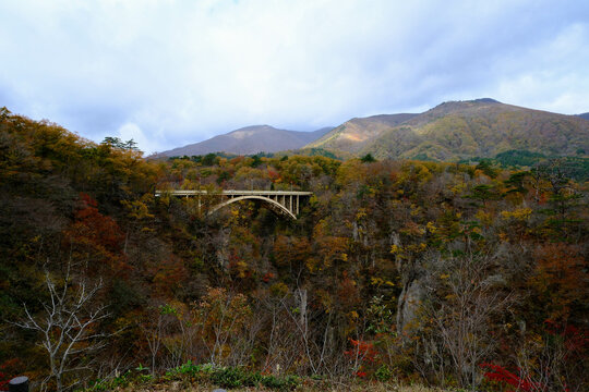Bridge passing through Naruko Gorge in autumn season.