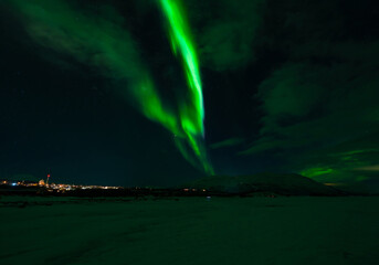 Aurora Borealis - Northern lights - above frozen lake Tornetrask in Abisko, Sweden